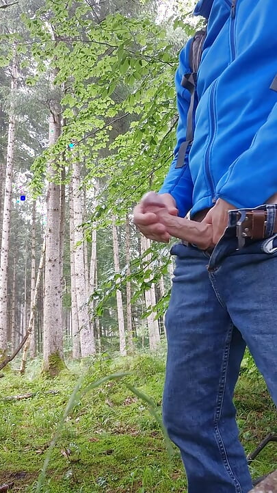 Horny in the forest while hiking and jerking off my hard cock in the rain – Part 1